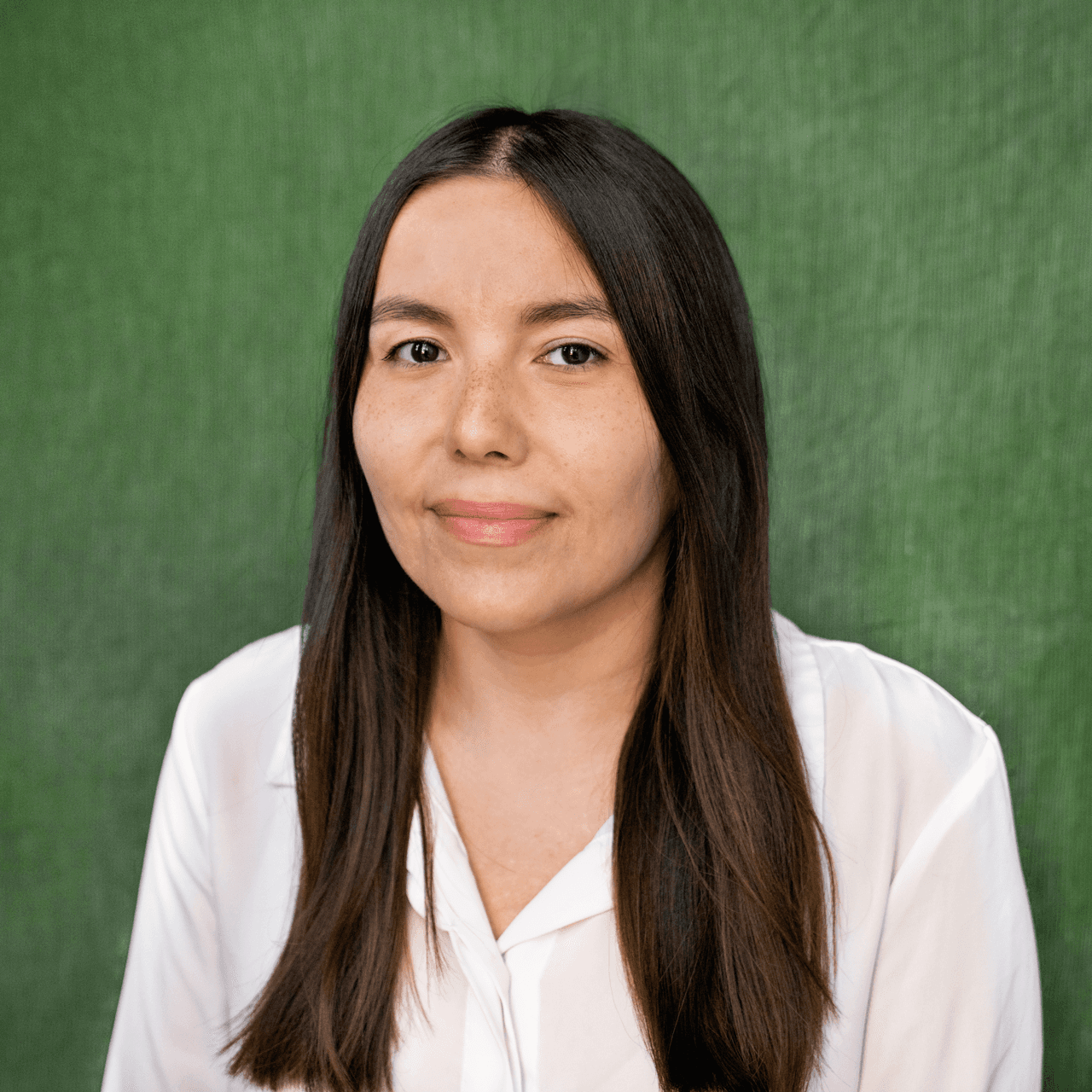 Image of a woman with long hair on a green background.